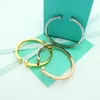 Marca de lujo Pulsera T Pareja de moda Pulsera de acero de titanio Pulsera de diseño de oro de 18 quilates de alta calidad Joyería con caja