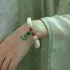 Perlen-Kürbis-Lotus-Perle, weiße Jade, Bodhisattva-Handschnur, Buddha-Perle, weibliche Hand, die Gebetsperlen trägt, Sicherheits-Glücksarmband YKKL
