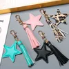 Nyckelringar Sansango Pu Leather Tassel Key Chain for Women Girl Star Pendant Hummer Clasp Key Rings Bag Tillbehör J240108