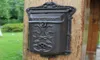 Mała żelazna skrzynka pocztowa montowana na ścianie dekoracje ogrodowe metalowa poczta litera postbolu pocztowa rustykalna brązowa domowa domek dekoracje patio v5984639