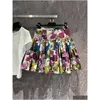 Rokken 2024 Vroege Lente Nieuwe Gekleurde Bloemenprint Hoge Taille Grote Rok A-lijn Mini Damesjurk Drop Levering Kleding Dames Clothi Otw7J