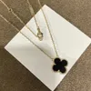 Bijoux de mode Double face chanceux herbe pendentif blanc Fritillaria 18K or Rose serrure chaîne en os quatre feuilles fleur collier pour femmes