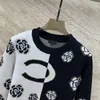 24SS FW Women Sweters Designer Tops Pullover Camellia Wzory Tops Marka pasa Projektant Crop Top Cashmere Blend Shirt High End Elastyczność Knitwearność zniszczona