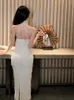 Sukienki swobodne białe kantar bandaż bandaż kobiety 2024 lato backless seksowne klub luksus elegancki impreza temperamentu wieczór