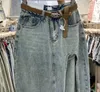 Kjolar kvinnors front slits blå denim kjolfickor hög midja smala dragkedja midi jeans 2024 kvinnlig casual streetwear p1230