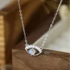 Catene europee e americane transfrontaliere in argento S925 semplici con una squisita collana di pietre al chiaro di luna, eleganti gioielli a forma di occhi