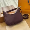 Diseñador Hobo bolso de lujo El nuevo bolso de la axila lienzo de cuero genuino bolso para mujer Cadenas de alta calidad Carteras Bolsos de hombro crossbody