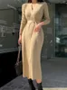 カジュアルドレス秋の冬の女性伸縮性服ニットロング女性ミュージャーセーターシンプルVネックボディコンラップドレスベスティドスローブフェム