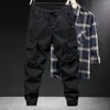 Pantalons pour hommes Hommes Cargo Printemps Automne avec taille élastique Cordon multi-poches Pantalon de sport en plein air pour streetwear