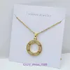 Pendentif de pneus de voiture Collier Meilleure vente Cadeau de Noël d'anniversaire Nouveau pendentif en cuivre micro incrusté de zircon rotatif Collier en acier titane pour femmes avec boîte d'origine