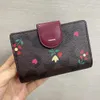 حقيبة مخلب للجنسين مصممين مع محفظة متعددة من السوستة COA
