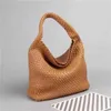 Handheld tas Jodie handwoven tas voor vrouwen 2024 Hoge capaciteit TOTE BABY MOEDER KABBAGE BAMK WATERMAKT Embique Straddle