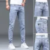 Männer Jeans Neue Frühling und Herbst Blau Gewaschen Koreanische Mode Lässig Feste Dünne Cowboy Stretch Denim Teenager Luxus Hosen Enge Männer JeansL240109