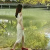 パーティードレス純粋な欲望風の妖精ホワイトVネックシャツドレスレディース2024夏のフランスのファッション気質ミッドレングススプリット