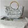 Totes 2023 Summer New Bamboo Handle Blue White Grass Woven Bag Round Dou Beach Handheld Women's Shoulder bagcatlin_fashion_bags