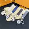 Tasarımcı Jewerlry Tasarımcı Marka Keychain Moda genç araba mektubu Keychain Yeni kadın çanta kordonları aşk cazibesi çift anahtarlık lüks deri küçük stil takılar