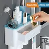 Set di accessori da bagno Accessori da bagno Porta spazzolino ad adsorbimento magnetico Dispenser automatico di dentifricio con contenitore per montaggio a parete della tazza