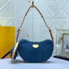 Bolso de mezclilla bolso de mano vintage Bag de cintura Bolso de hombro Bolsas para mujeres Bolsas para peluquería de lienzo Bag antigua Bolsa de axilas impresas Mochila mochila Gold Hardware 46203 468