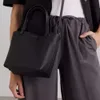 Die Reihe kleiner Eimer -Leder -Tasche mit Litschi -Muster Einer Schulter -Unterarmtasche für Frauen hochwertige Reihenbeutel