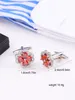 Boutons de manchette opulents incrustés de zircon rouge avec un design en cuivre pur à quatre pétales, accessoires exquis faits à la main pour hommes