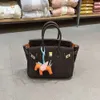 Designer väskor lyxiga mode totes togo läder ebenholts väska med orange handväska inuti fashionabla toppskikt kohude pendlare cross-body kvinnors väska trend