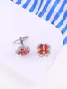 Boutons de manchette opulents incrustés de zircon rouge avec un design en cuivre pur à quatre pétales, accessoires exquis faits à la main pour hommes