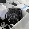Kvinnors minikvalitet ryggsäck spegel svart quiltad lammskinn 10a handväska lyxiga designers 18 cm duma dubbelkedja axel guldlåda påse riktiga läder koppling handväskor
