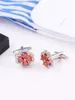 Boutons de manchette opulents incrustés de zircon rouge avec un design en cuivre pur à quatre pétales, accessoires exquis faits à la main pour hommes