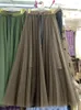Kjolar koreanska mode tyll för kvinnor oregelbundna mesh elastiska höga midja damkakor kjol a-line kvinnlig maxi droppe