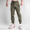 Herrbyxor män joggar casual last flerficka byxor manlig sport gym sweatpants bomull som kör streetwear man kläder 3xl