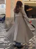 Women's lapel wool blend pleated coat elegant and loose long sleeved single chest warm coat 2024 new women's street coat 240112