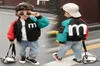 Vestes pour enfants au printemps chant les couches extérieures mignonnes pour garçons pour bébés filles coat de vent2584315