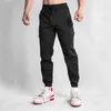 Herrbyxor män joggar casual last flerficka byxor manlig sport gym sweatpants bomull som kör streetwear man kläder 3xl