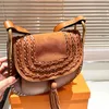 Fashion Designer bag The most popular tassel design is trendy cowhide quality size 23X19cm saddle bag Hand-held crossbody bag