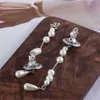 Viviane Westwoodly örhängen Asymmetrisk trasig pärla tredimensionell planet Tasselörhängen Kvinnors långa pärlstav vatten droppmode örhängen örhängen