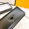 Designer de luxo feminino bolsa de moedas 24 novos clássicos moda grande capacidade verdadeira bolsa de coleta marca francesa famosa triângulo sinal de alta qualidade carteira de cor sólida