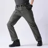 Plus Size 6XL Pantaloni cargo da uomo Multi tasca Pantaloni sportivi tattici da esterno Esercito militare Pantaloni da trekking elastici ad asciugatura rapida impermeabili 240111