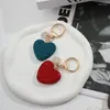 Llaveros Llaveros de corazón de diamantes de imitación completos Anillos de aleación de lujo ligeros para niñas Pequeño anillo fresco Colgante de bolso Creativo