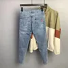 Modedesigner män jeans retro stretch smal fit målade rippade jeans män koreansk stil vintage casual denim pants streetwear 240112