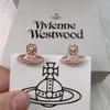 Vivianism Westwoodism örhängen 23 Saturn Rice Pearl Earrings Female Crowd Design Fashionable Planet Pearl Earrings