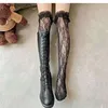 Bas de Style japonais Sexy, chaussettes en résille avec nœud papillon, anti-accrochage, bas en dentelle creuse, collants en filet de poisson 240111