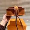 Fashion Designer bag The most popular tassel design is trendy cowhide quality size 23X19cm saddle bag Hand-held crossbody bag