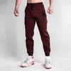 Herrbyxor män joggar casual last flerficka byxor manlig sport gym sweatpants bomull som kör streetwear man kläder 3xl