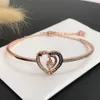 Pulsera Swarovskis Diseñador Mujer Brazalete de calidad superior Noche estrellada Charla de miel Pulsera en forma de corazón Elemento femenino Pulsera de corazón de cristal Mujer