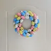 Fiori decorativi come mostrato nell'immagine Decorazione da appendere alla porta che decora la ghirlanda di uova di Pasqua realizzata in alta qualità per