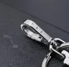 Kordonlar en iyi tasarımcı unisex siyah anahtar zincirli aksesuarlar p anahtarlıklar mektup lüks desen araba anahtar zinciri el yapımı mücevher hediyeleri anahtar çanta için kordonlar yüksek kalite
