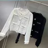 2024C Ny Spring Fall Women's Luxury White Black Metal Button Sweaters With Tassel Edge Sticked Designer Metal Letter Paste Jumper tröja för Girls Woma