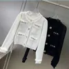 2024C Ny Spring Fall Women's Luxury White Black Metal Button Sweaters With Tassel Edge Sticked Designer Metal Letter Paste Jumper tröja för Girls Woma
