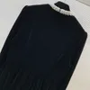 2024 Spring Black Solid Color Beaded Brooch Velour Dress Long Sleeve Round Neck Panelled Short Casual Dresses B4J121128