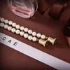 Kvinnors pärla öronhalsband med stämpel lyxig tröja kedja flicka par boutique gåva halsbandslåda förpackning av hög kvalitet smycken